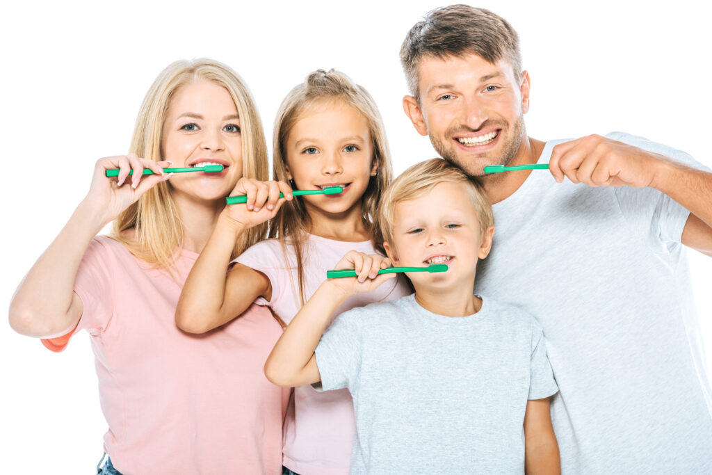 Dental Coverage happy parents and children holding toothbrushes wh 2022 12 16 20 18 39 utc 1024x683
